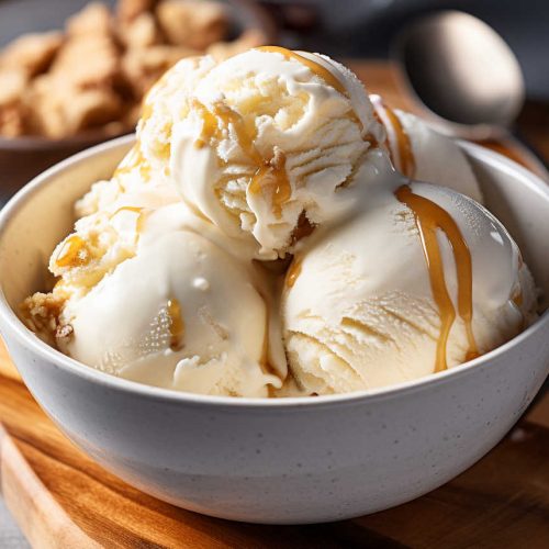 Scoops of homemade maple ice cream in a bowl.