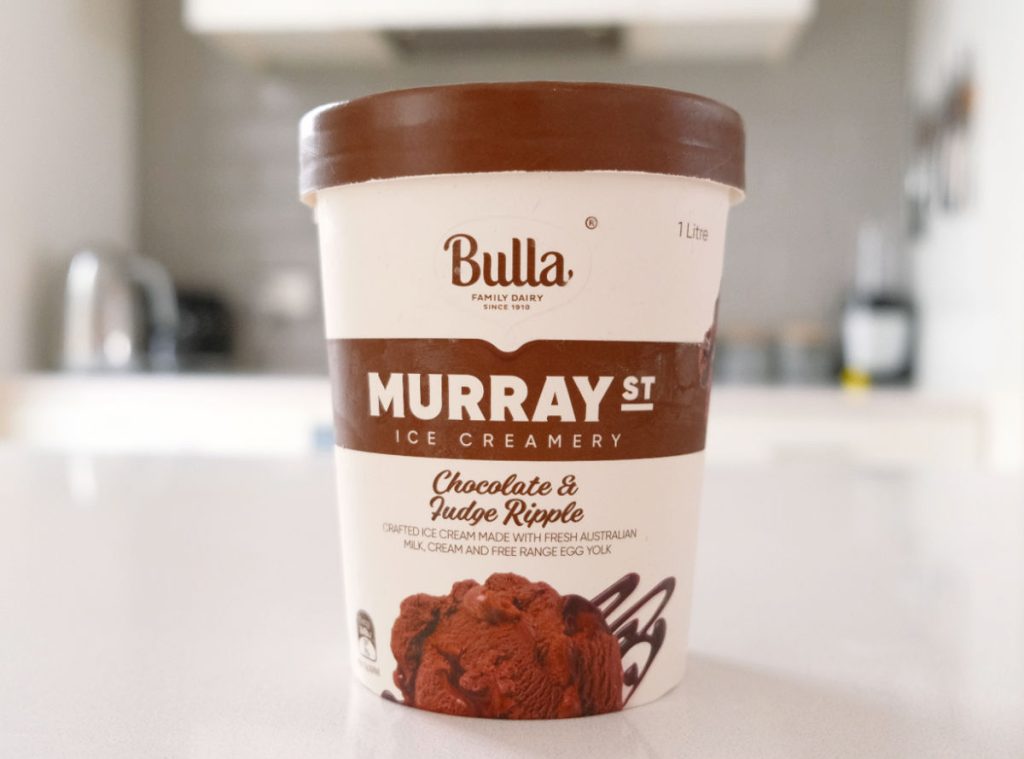 A tub of Murray St Chocolate and Fudge Ripple on the kitchen benchtop