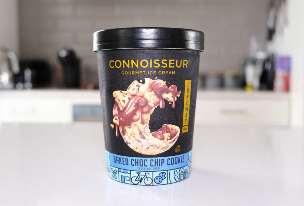 A tub of Connoisseur Baked Choc Chip Cookie Ice Cream on a kitchen bench.