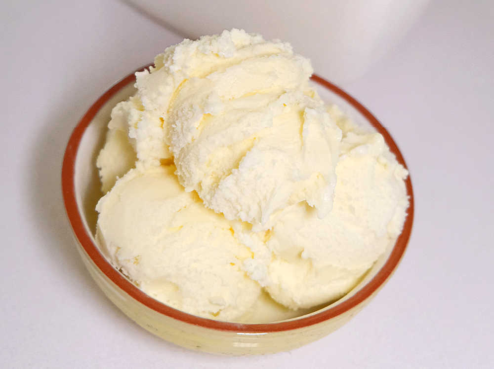 A bowl of vanilla reduced fat ice cream by Coles.