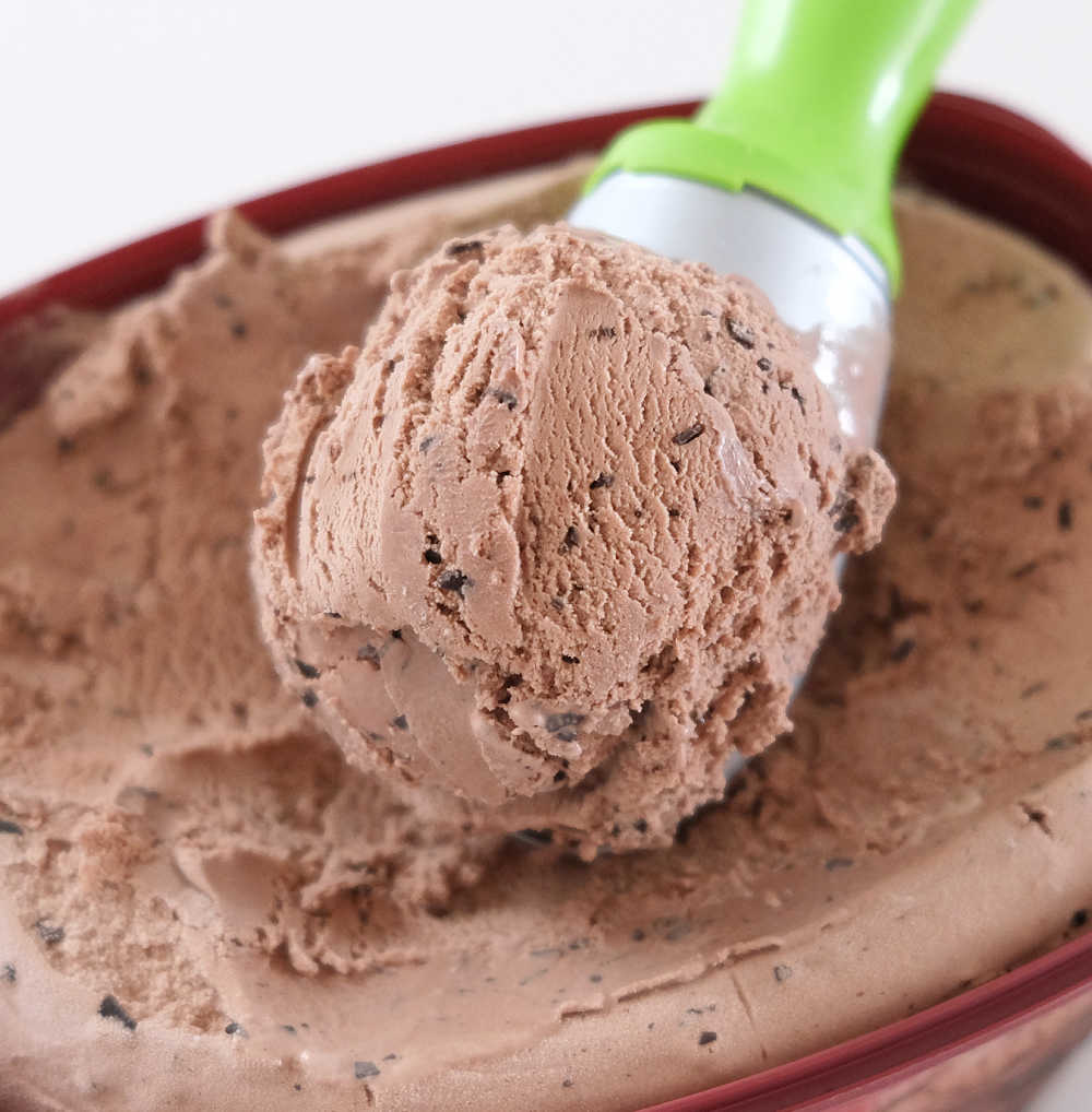 A closeup of a scoop of Bulla Choc Chip Ice Cream 2L.