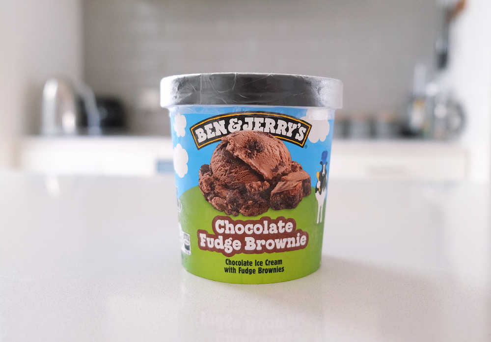 A pint of Ben & Jerry's Chocolate Fudge Brownie Ice Cream on a kitchen bench.