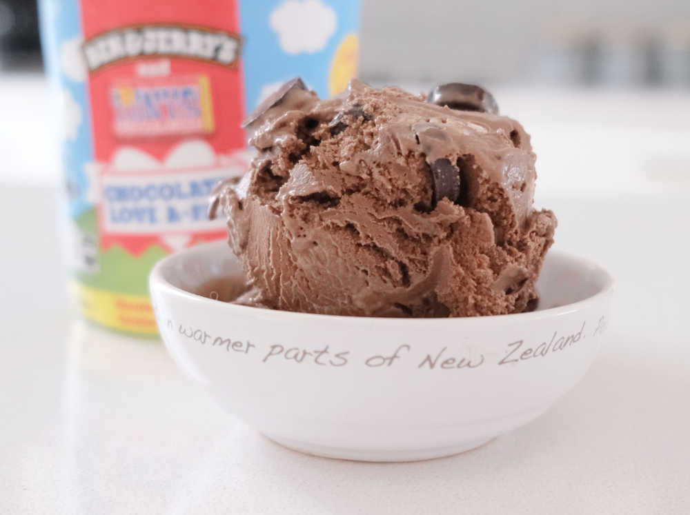 A bowl of Ben & Jerry's Chocolatey Love A-Fair with the pack in the background.