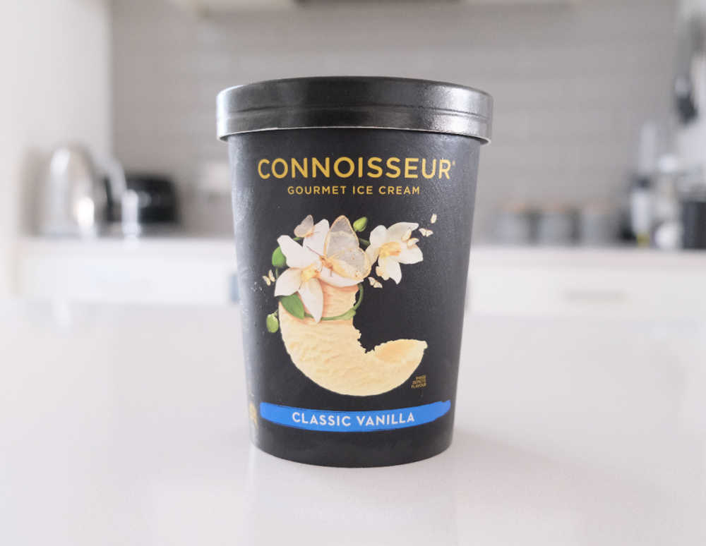 A tub of Connoisseur Gourmet Ice Cream Classic Vanilla 1L on the kitchen bench.